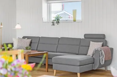 a living room with a gray couch and a table at 167-Thisted-Vesterhavsgade-158 in Thisted