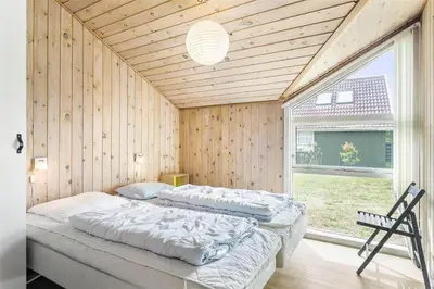 a bedroom with two beds in a room with a window at 504-Thisted-Nordsovej-206-C in Thisted