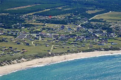an aerial view of a beach with a group of houses at 916-Thisted-Spanggardsvej-59 in Torsted