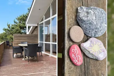 a porch of a house with a table and chairs at 916-Thisted-Spanggardsvej-59 in Torsted