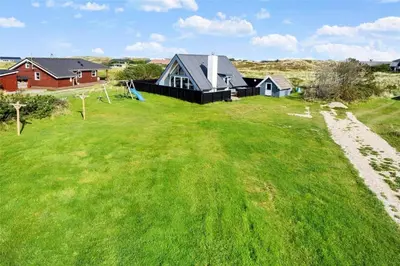 an image of a house in a field of grass at 1007-Thisted-Mombak-7 in Torsted