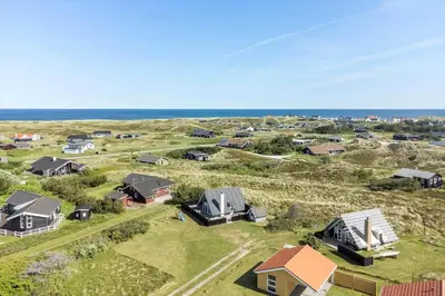 an aerial view of a home with the ocean in the background at 1007-Thisted-Mombak-7 in Torsted