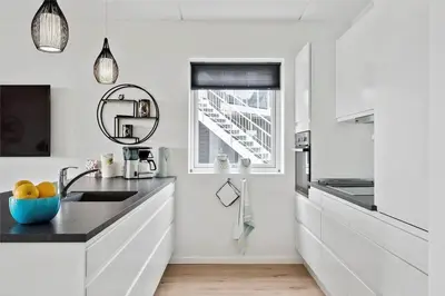 a white kitchen with a sink and a window at 774-Thisted-Havstokken-26-A in Thisted