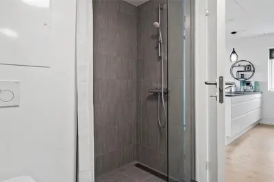 a shower with a glass door in a bathroom at 774-Thisted-Havstokken-26-A in Thisted