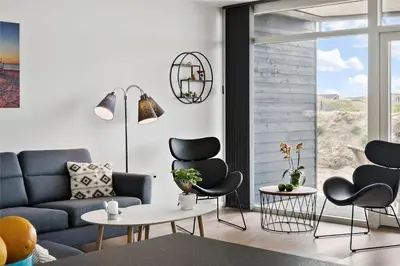 a living room with a couch and two chairs at 774-Thisted-Havstokken-26-A in Thisted