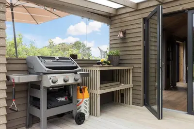 a barbecue grill on a deck with a patio at 157-Thisted-Isfuglevej-17 in Thisted