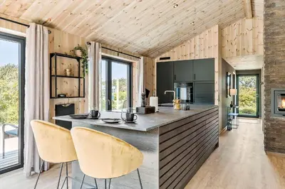 a kitchen with a large island in a room with windows at 157-Thisted-Isfuglevej-17 in Thisted
