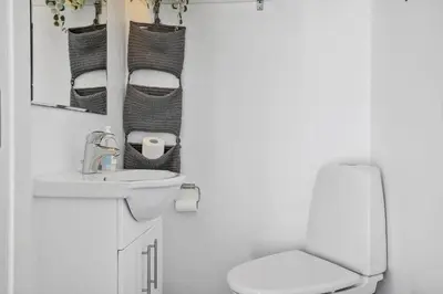 a white bathroom with a sink and a toilet at 332-Thisted-Kristinesvej-32 in Thisted