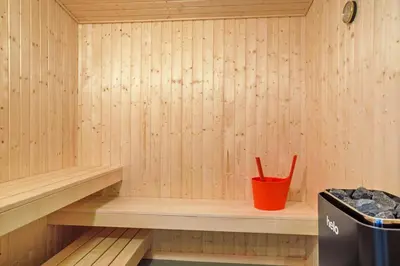 a sauna with a red cup and a trash can at 1028-Thisted-Tingbakken-28 in Torsted