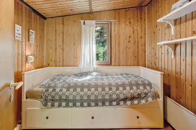 a bedroom with a bed in a room with a window at 242-Thisted-Muslingevej-4 in Thisted