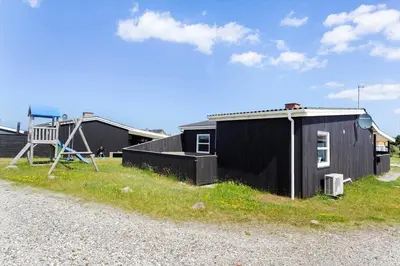 a small black building next to a playground at 870-Thisted-Nordsovej-34 in Thisted
