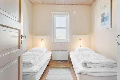 two beds in a room with a window at 870-Thisted-Nordsovej-34 in Thisted