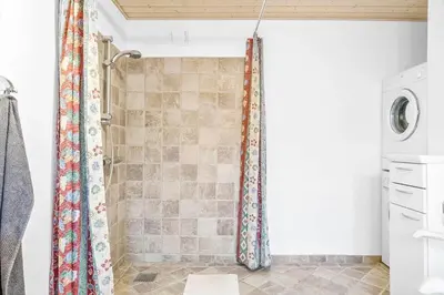 a shower in a bathroom with a shower curtain at 388-Thisted-Hummervej-8 in Thisted