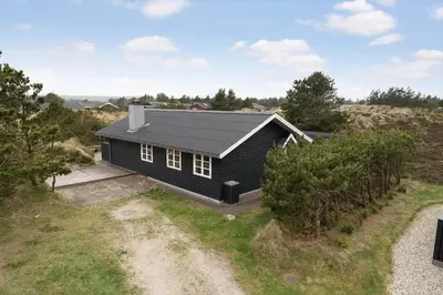 an aerial view of a black house on a hill at 930-Thisted-Liusborg-Sti-28 in Torsted