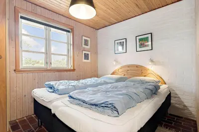 a large bed in a room with a window at 930-Thisted-Liusborg-Sti-28 in Torsted