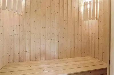 a wooden sauna with a wood paneled wall at 858-Thisted-Delfinvej-24 in Thisted