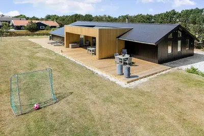 a house with a soccer ball on a field at 209-Vestervig-Isfuglevej-15 in Vestervig