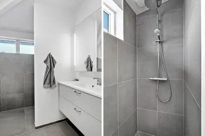 a white bathroom with a shower and a sink at 926-Thisted-Niels-Vognmands-Vej-15 in Torsted