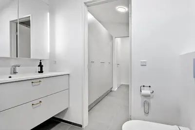 a white bathroom with a sink and a toilet at 926-Thisted-Niels-Vognmands-Vej-15 in Torsted