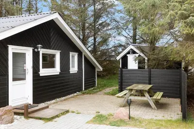 a black building with a picnic table in front of it at 862-Thisted-Nordsovej-162 in Thisted