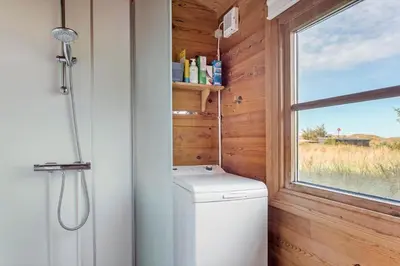 a bathroom with a toilet and a window at 651-Snedsted-Somaerkevej-50 in Snedsted