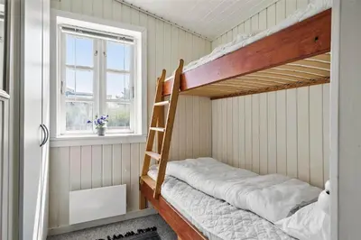 a bunk bed in a room with a window at 727-Thisted-Blamunkevej-11 in Thisted