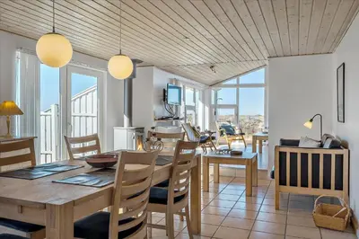 a dining room with a wooden table and chairs at 608-Thisted-Vesterhavsgade-49-A in Thisted