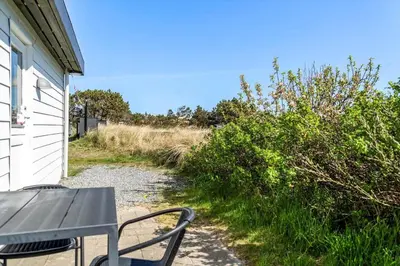 a picnic table sitting on the side of a house at 586-Thisted-Havbovej-30 in Thisted