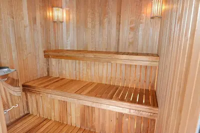 a wooden sauna with two wooden shelves in it at 975-Thisted-Klitstien-45 in Torsted