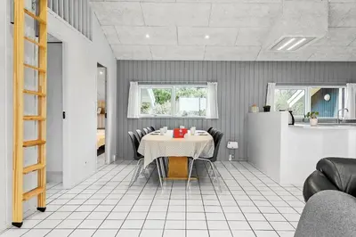 a dining room with a table and chairs at 975-Thisted-Klitstien-45 in Torsted