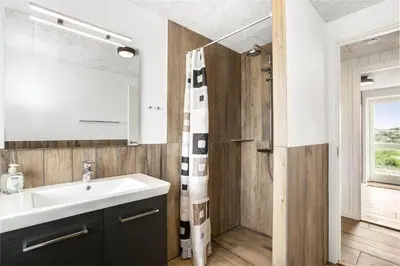 a bathroom with a sink and a shower at 899-Snedsted-Somaerkevej-76-B in Snedsted