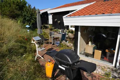 a motorcycle parked in front of a house at 1030-Thisted-Lyngstien-15-A in Torsted