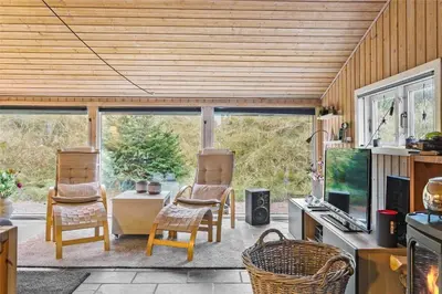 a living room with two chairs and a table at 1030-Thisted-Lyngstien-15-A in Torsted