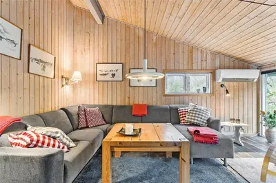 a living room with a couch and a table at 1030-Thisted-Lyngstien-15-A in Torsted