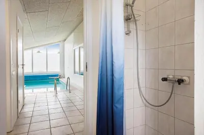 a bathroom with a shower and a swimming pool at 446-Thisted-Nordsovej-206-F in Thisted