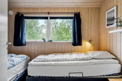 a bedroom with two beds and a window at 512-Thisted-Sotungevej-4 in Thisted
