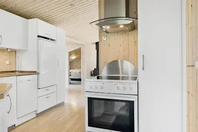 a kitchen with a stove with a pot on top of it at 710-Thisted-Klitrosevej-10 in Thisted