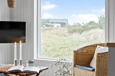 a living room with a table and a window at 145-Thisted-Fiskervej-25-B in Thisted