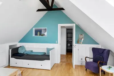 a bedroom with a bed and a blue wall at 822-Thisted-Bredkaervej-8 in Thisted