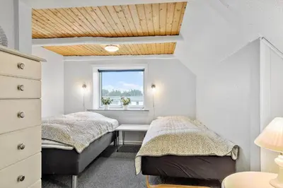 a bedroom with two beds and a window at 172-Thisted-Fiskervej-72 in Thisted