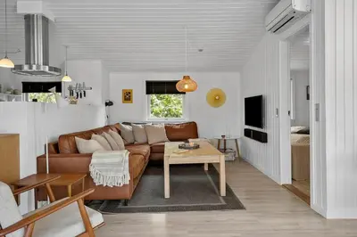 a living room with a couch and a table at 576-Thisted-Klemsvej-26-E in Thisted
