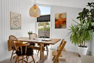 a dining room with a wooden table and chairs at 576-Thisted-Klemsvej-26-E in Thisted