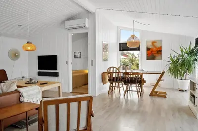 a living room with a table and a dining room at 576-Thisted-Klemsvej-26-E in Thisted