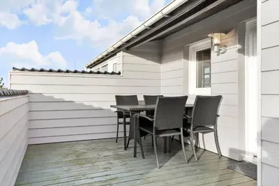 a deck with a table and chairs on a house at 276-Thisted-Nordsovej-76 in Thisted