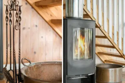 a wood stove in a kitchen with a staircase at 186-Vestervig-Magevej-5 in Vestervig