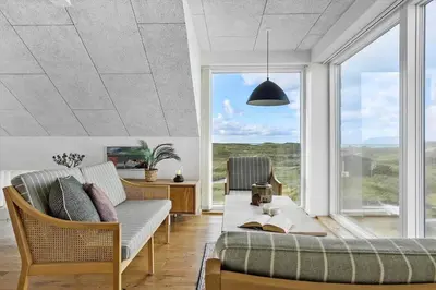 a living room with a couch and a table at 1053-Thisted-Kraenhavs-Sti-8 in Torsted