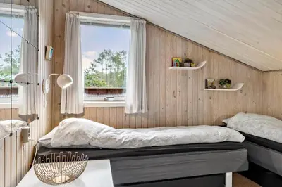 a bedroom with two beds and a window at 815-Thisted-Blamunkevej-45 in Thisted