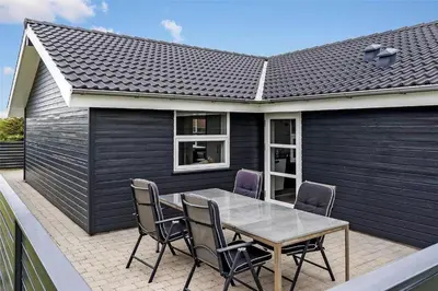 a patio with a table and chairs on it at 409-Thisted-Flyndervej-8 in Thisted