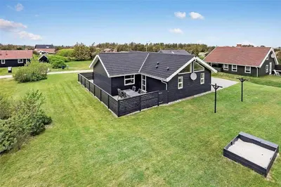 an aerial view of a black house in a yard at 409-Thisted-Flyndervej-8 in Thisted