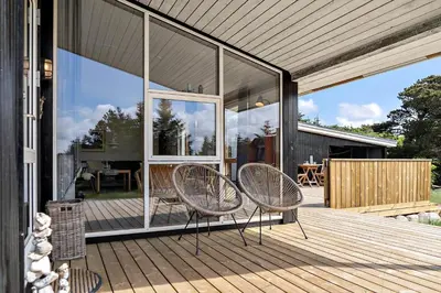 two chairs sitting on the deck of a house at 638-Thisted-Lyngvej-6 in Thisted